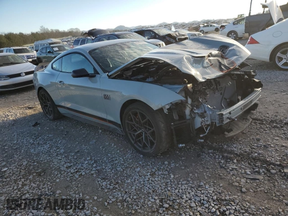 2021 Ford Mustang Mach 1 with VIN 1FA6P8R06M5551345, listed as a Copart auction lot 86491604 with 7,374 mi miles and Salvage Title. Bid and sale history available at carsss.com. Image 4.