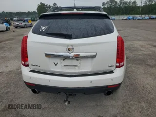 2013 Cadillac SRX Performance Collection z VIN 3GYFNHE33DS602428, wystawiony jako Copart lot #55688555 z przebiegiem 143 504 mil mil oraz Szkody całkowita. Historia ofert i sprzedaży dostępna na DreamBid. Obrazek 6.