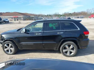 2014 Jeep Grand Cherokee Overland with VIN 1C4RJECG4EC523747, listed as a IAAI auction lot 40802143 with 124,079 mi miles. Bid and sale history available at carsss.com. Image 14.