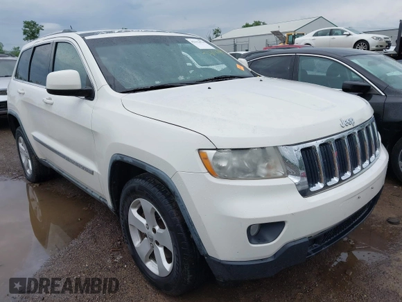 2011 Jeep Grand Cherokee Laredo z VIN 1J4RR4GG1BC572827, wystawiony jako IAAI lot #42313674 z przebiegiem 273 215 mil mil oraz . Historia ofert i sprzedaży dostępna na DreamBid. Obrazek 1.