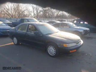 1996 Honda Accord EX w/Leather with VIN 1HGCD5666TA176707, listed as a IAAI auction lot 41328043 with 174,374 mi miles. Bid and sale history available at carsss.com. Image 1.