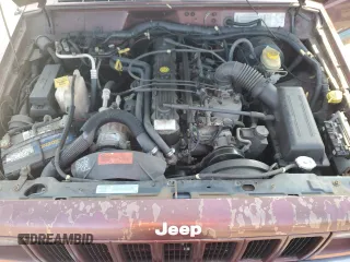 2000 Jeep Cherokee z VIN 1J4FF48S2YL135037, wystawiony jako Copart lot #66156505 z przebiegiem 72 433 mil mil oraz Szkoda całkowita • Salvage title. Historia ofert i sprzedaży dostępna na DreamBid. Obrazek 11.