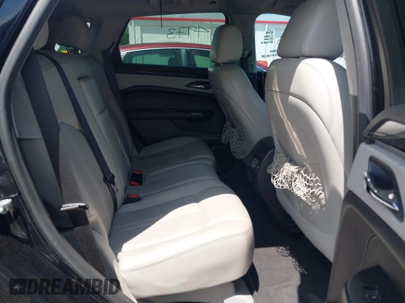 2015 Cadillac SRX Performance Collection with VIN 3GYFNCE30FS549872, listed as a IAAI auction lot 42201529 with 125,128 mi miles and . Bid and sale history available at DreamBid. Image 8.