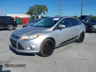 2012 Ford Focus SE with VIN 1FAHP3F23CL265724, listed as a IAAI auction lot 41184121 with 216,873 mi miles. Bid and sale history available at carsss.com. Image 2.