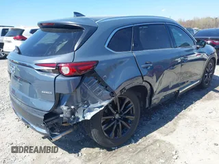2021 Mazda CX-9 Carbon Edition with VIN JM3TCADY9M0517174, listed as a IAAI auction lot 41871485 with 48,484 mi miles and . Bid and sale history available at DreamBid. Image 4.