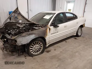 1999 Pontiac Grand Am SE2 with VIN 1G2NE52E4XM864232, listed as a IAAI auction lot 41321705 with 1 mi miles. Bid and sale history available at carsss.com. Image 2.