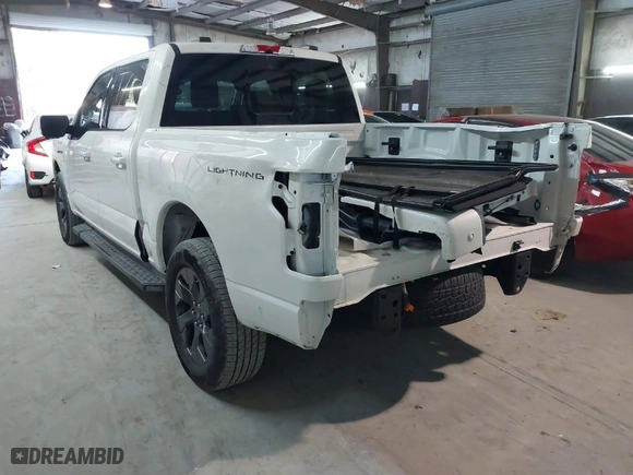 2023 Ford F-150 Lightning Pro with VIN 1FT6W1EV5PWG51022, listed as a IAAI auction lot 41364481 with NaN miles. Bid and sale history available at carsss.com. Image 3.