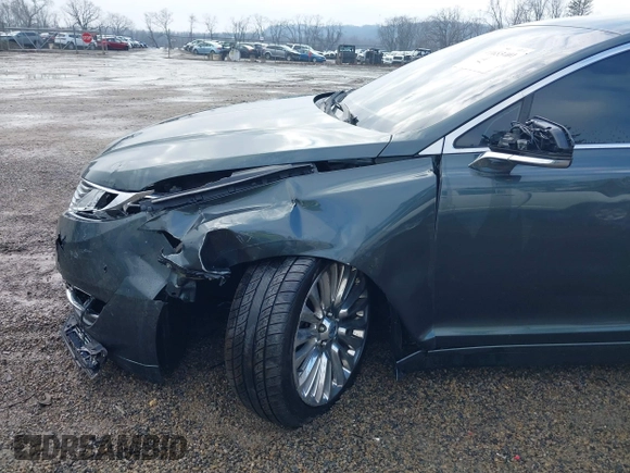 2015 Lincoln MKZ z VIN 3LN6L2J90FR616800, wystawiony jako IAAI lot #41683401 z przebiegiem 92 239 mil mil oraz . Historia ofert i sprzedaży dostępna na DreamBid. Obrazek 17.