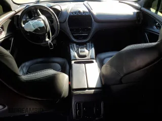 2021 Aston Martin DBX z VIN SCFVUJAWXMTV01292, wystawiony jako Copart lot #83824504 z przebiegiem Nie podano mil oraz Szkody całkowita. Historia ofert i sprzedaży dostępna na DreamBid. Obrazek 8.