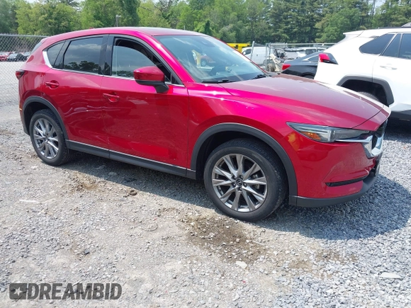 2021 Mazda CX-5 Grand Touring with VIN JM3KFBDM3M0434569, listed as a IAAI auction lot 42422349 with 25,924 mi miles and . Bid and sale history available at DreamBid. Image 1.