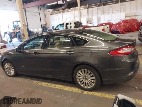 2016 Ford Fusion SE Hybrid with VIN 3FA6P0LU9GR235291, listed as a IAAI auction lot 41560312 with 112,777 mi miles. Bid and sale history available at carsss.com. Image 13.