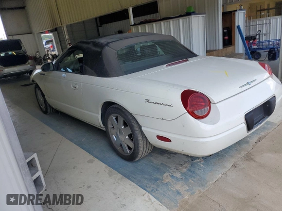 2002 Ford Thunderbird Hardtop Premium z VIN 1FAHP60A52Y130277, wystawiony jako Copart lot #69473594 z przebiegiem Nie podano mil oraz Szkoda całkowita • Salvage title. Historia ofert i sprzedaży dostępna na DreamBid. Obrazek 2.