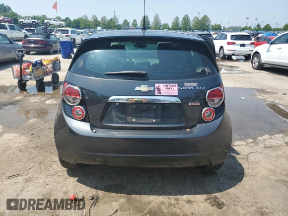 2014 Chevrolet Sonic LTZ z VIN 1G1JE6SB5E4241777, wystawiony jako Copart lot #60117705 z przebiegiem 139 287 mil mil oraz Czysty tytuł • Clean title. Historia ofert i sprzedaży dostępna na DreamBid. Obrazek 6.