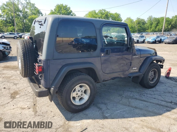 2003 Jeep Wrangler Sport z VIN 1J4FA49S13P347815, wystawiony jako Copart lot #59536685 z przebiegiem 74 298 mil mil oraz Szkoda całkowita • Salvage title. Historia ofert i sprzedaży dostępna na DreamBid. Obrazek 3.