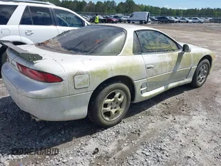 1997 Mitsubishi 3000GT z VIN JA3AM44H8VY006247, wystawiony jako IAAI lot #42233155 z przebiegiem 135 479 mil mil oraz . Historia ofert i sprzedaży dostępna na DreamBid. Obrazek 4.
