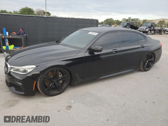 2016 BMW 7 Series 750i with VIN WBA7F0C56GGL99533, listed as a Copart auction lot 59091045 with 124,624 mi miles and Clean title. Bid and sale history available at DreamBid. Image 1.