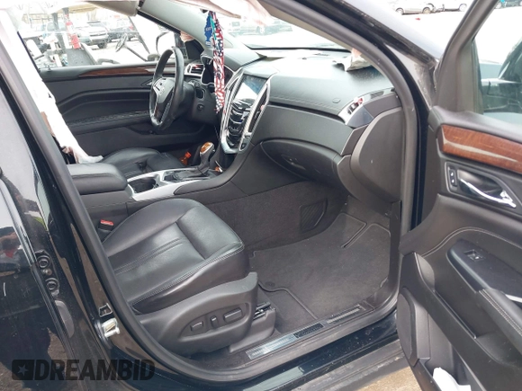 2015 Cadillac SRX Premium Collection with VIN 3GYFNGE37FS556860, listed as a IAAI auction lot 41854634 with 170,808 mi miles and . Bid and sale history available at DreamBid. Image 5.