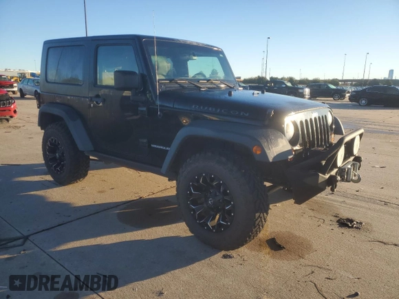 2010 Jeep Wrangler Rubicon with VIN 1J4BA6D10AL203265, listed as a Copart auction lot 79570754 with 114,840 mi miles and Salvage title. Bid and sale history available at DreamBid. Image 4.