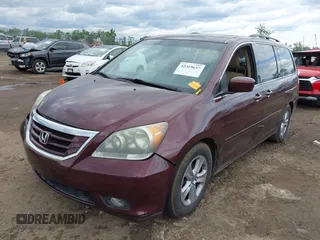 2009 Honda Odyssey Touring with VIN 5FNRL38929B037150, listed as a IAAI auction lot 42319657 with 183,663 mi miles and . Bid and sale history available at DreamBid. Image 2.