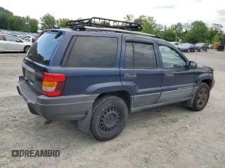 2004 Jeep Grand Cherokee Laredo with VIN 1J4GW48S64C160831, listed as a Copart auction lot 61920005 with 135,243 mi miles and Clean title. Bid and sale history available at DreamBid. Image 3.