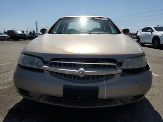 2000 Nissan Altima XE z VIN 1N4DL01D5YC243801, wystawiony jako Copart lot #52642985 z przebiegiem 237 665 mil mil oraz Szkoda całkowita • Salvage title. Historia ofert i sprzedaży dostępna na DreamBid. Obrazek 5.
