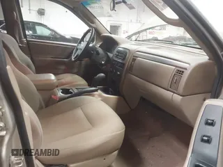 2004 Jeep Grand Cherokee Laredo with VIN 1J4GW48S44C321869, listed as a IAAI auction lot 41822099 with 181,663 mi miles. Bid and sale history available at carsss.com. Image 5.