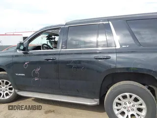 2015 GMC Yukon SLT z VIN 1GKS1BKCXFR192349, wystawiony jako IAAI lot #41842474 z przebiegiem 185 166 mil mil oraz . Historia ofert i sprzedaży dostępna na DreamBid. Obrazek 14.