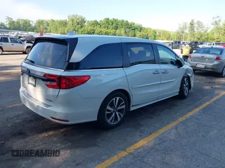 2022 Honda Odyssey Touring with VIN 5FNRL6H88NB026592, listed as a IAAI auction lot 42367048 with 57,066 mi miles and . Bid and sale history available at DreamBid. Image 4.