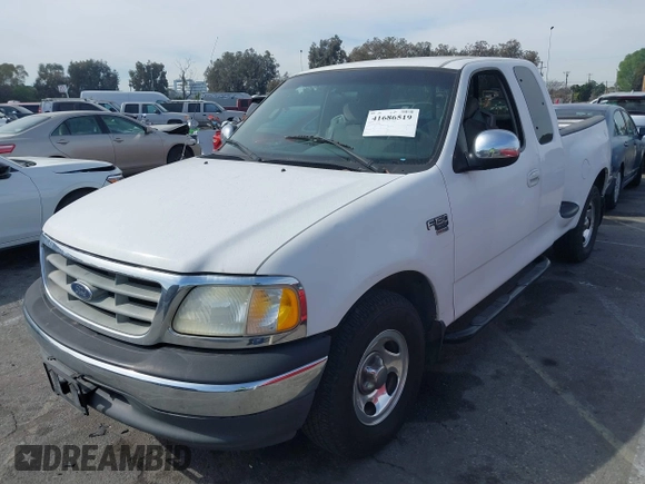 2001 Ford F-150 XL with VIN 1FTRX07L91KA77460, listed as a IAAI auction lot 41686519 with 185,286 mi miles. Bid and sale history available at carsss.com. Image 2.