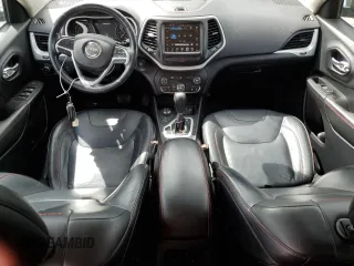 2014 Jeep Cherokee Trailhawk with VIN 1C4PJMBS6EW159174, listed as a Copart auction lot 56097795 with 130,299 mi miles and Salvage title. Bid and sale history available at DreamBid. Image 8.
