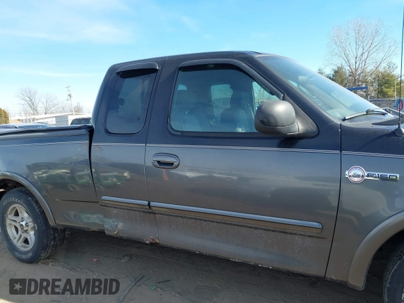 2003 Ford F-150 XL with VIN 1FTRX17W53NB00671, listed as a IAAI auction lot 41576739 with 194,066 mi miles. Bid and sale history available at carsss.com. Image 13.