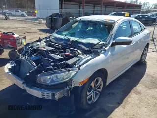 2017 Honda Civic Sedan LX with VIN 2HGFC2F58HH513036, listed as a IAAI auction lot 41815183 with 33,932 mi miles. Bid and sale history available at carsss.com. Image 2.