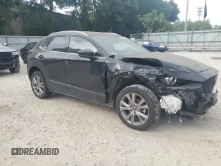 2023 Mazda CX-30 2.5 S Premium Package with VIN 3MVDMBDMXPM501188, listed as a Copart auction lot 64816164 with 0 mi miles and Salvage Title. Bid and sale history available at carsss.com. Image 4.