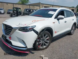 2020 Mazda CX-9 Grand Touring with VIN JM3TCBDY3L0410674, listed as a IAAI auction lot 42389157 with 130,519 mi miles and . Bid and sale history available at DreamBid. Image 2.