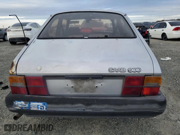 1987 Saab 900 z VIN YS3AK35D8H2020243, wystawiony jako Copart lot #47843125 z przebiegiem 112 526 mil mil oraz Tytuł czysty. Historia ofert i sprzedaży dostępna na DreamBid. Obrazek 6.