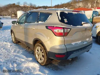 2017 Ford Escape SE with VIN 1FMCU9GD0HUF04174, listed as a IAAI auction lot 41327379 with 101,122 mi miles. Bid and sale history available at carsss.com. Image 3.