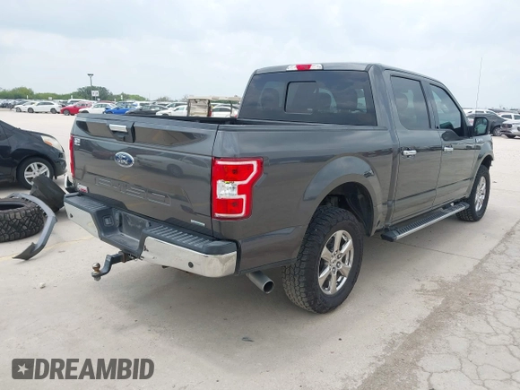 2018 Ford F-150 XL with VIN 1FTEW1EGXJKD18696, listed as a IAAI auction lot 42128458 with 80,811 mi miles and . Bid and sale history available at DreamBid. Image 4.