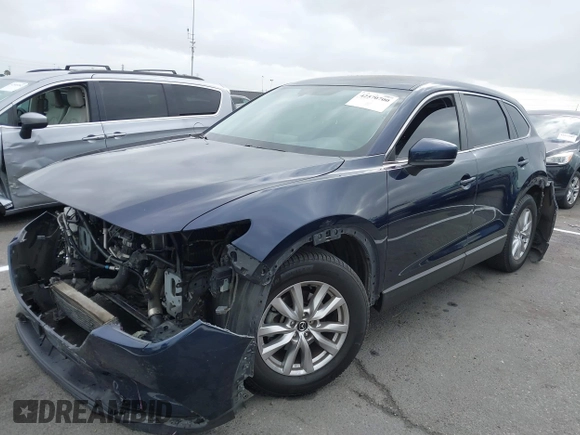 2016 Mazda CX-9 Sport with VIN JM3TCABY3G0123239, listed as a IAAI auction lot 42570700 with 119,414 mi miles and . Bid and sale history available at DreamBid. Image 18.