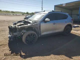 2019 Mazda CX-5 Grand Touring with VIN JM3KFADM6K0543888, listed as a Copart auction lot 56310785 with 112,737 mi miles and Salvage title. Bid and sale history available at DreamBid. Image 1.