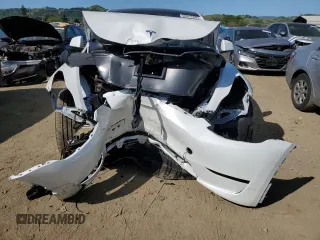 2024 Tesla Model Y Long Range with VIN 7SAYGDEE0RF081948, listed as a Copart auction lot 52612805 with 12,099 mi miles and Salvage Title. Bid and sale history available at DreamBid. Image 5.