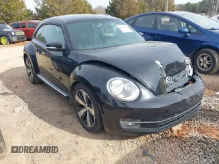 2012 Volkswagen Beetle 2.0T Turbo w/Sun/Snd/Nav PZEV with VIN 3VWVA7AT4CM655068, listed as a IAAI auction lot 41605197 with 115,546 mi miles. Bid and sale history available at carsss.com. Image 1.