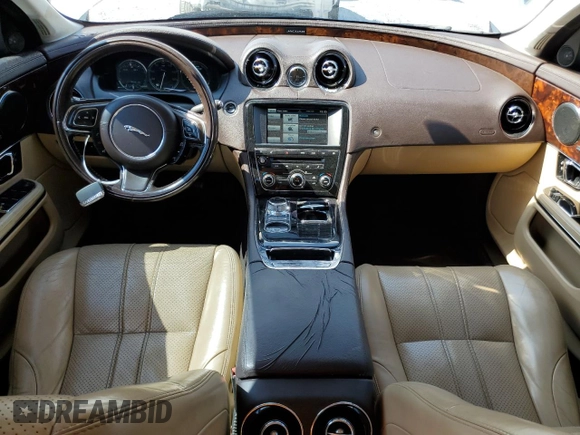 2015 Jaguar XJ with VIN SAJWA1CZ8F8V81637, listed as a Copart auction lot 55619555 with 88,328 mi miles and Salvage Title. Bid and sale history available at DreamBid. Image 8.