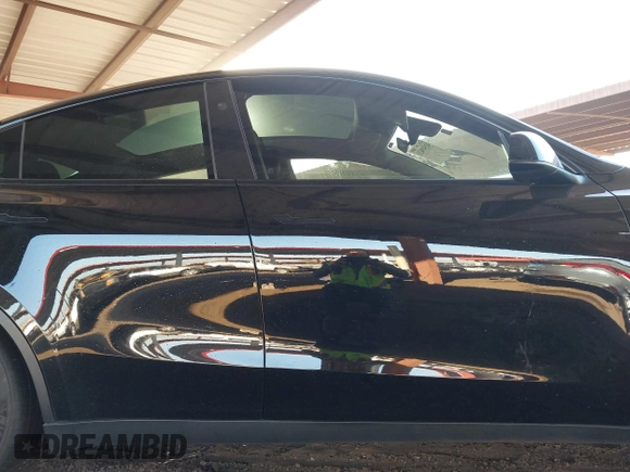2023 Tesla Model Y Long Range with VIN 7SAYGDEE8PF815622, listed as a IAAI auction lot 41515433 with 70,862 mi miles and . Bid and sale history available at DreamBid. Image 13.