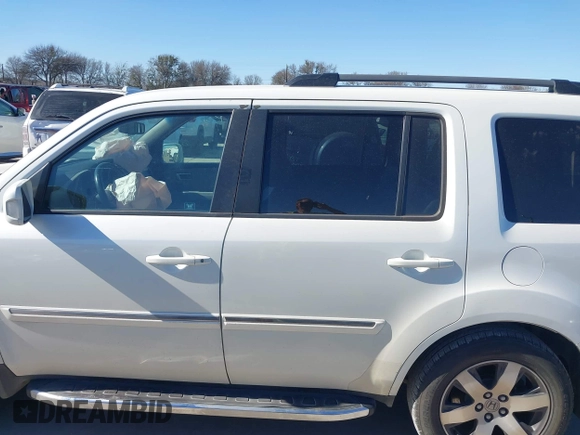 2012 Honda Pilot Touring with VIN 5FNYF3H91CB020673, listed as a IAAI auction lot 41721836 with 123,607 mi miles and . Bid and sale history available at carsss.com. Image 14.