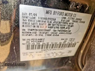 2005 Ford Five Hundred SE z VIN 1FAFP23135G155457, wystawiony jako Copart lot #59118245 z przebiegiem 157 582 mil mil oraz Tytuł czysty. Historia ofert i sprzedaży dostępna na DreamBid. Obrazek 10.