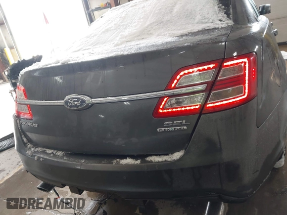 2015 Ford Taurus SEL with VIN 1FAHP2E89FG202589, listed as a IAAI auction lot 41592298 with 105,410 mi miles and . Bid and sale history available at carsss.com. Image 16.