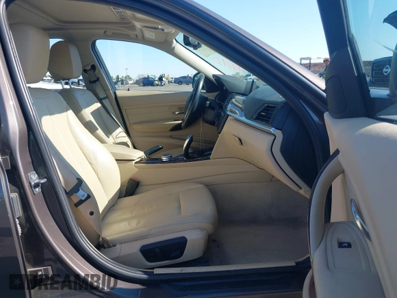 2014 BMW 3 Series 328i with VIN WBA3C1C57EK116483, listed as a IAAI auction lot 42697759 with 113,010 mi miles and . Bid and sale history available at DreamBid. Image 5.