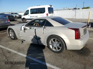 2006 Cadillac XLR z VIN 1G6YV36AX65603770, wystawiony jako Copart lot #81527954 z przebiegiem 59 498 mil mil oraz Szkody całkowita. Historia ofert i sprzedaży dostępna na DreamBid. Obrazek 2.
