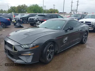 2018 Ford Mustang EcoBoost z VIN 1FA6P8TH2J5184485, wystawiony jako IAAI lot #41884810 z przebiegiem 74 999 mil mil oraz . Historia ofert i sprzedaży dostępna na DreamBid. Obrazek 2.