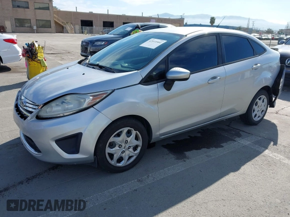 2012 Ford Fiesta SE with VIN 3FADP4BJ2CM150953, listed as a IAAI auction lot 42010904 with 77,637 mi miles. Bid and sale history available at carsss.com. Image 2.